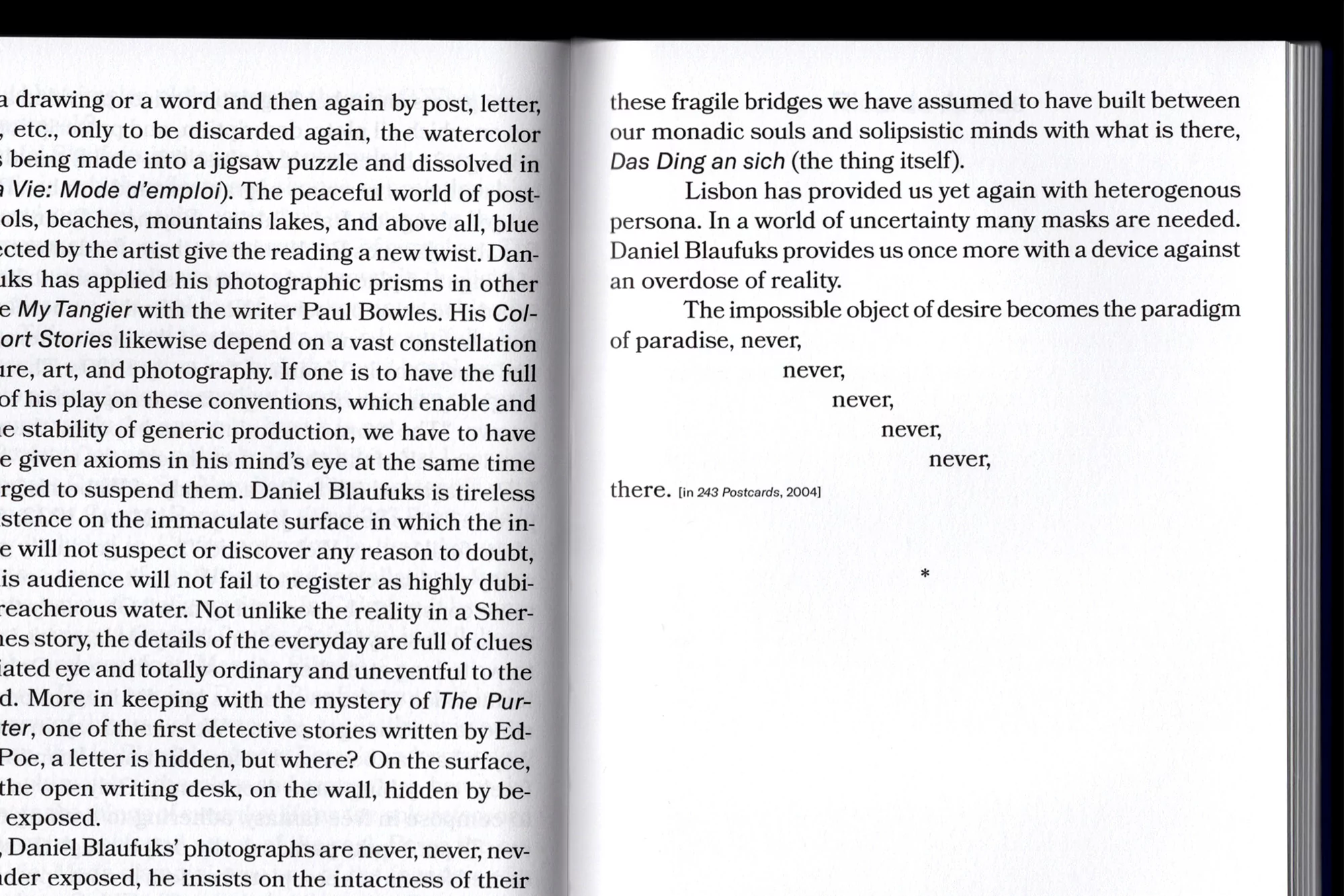 Open book pages featuring text, focusing on typography and literary content within a bright indoor setting.