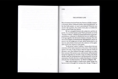 Open book layout displaying black typography on white pages with the heading The Divided Line under the year 1992.