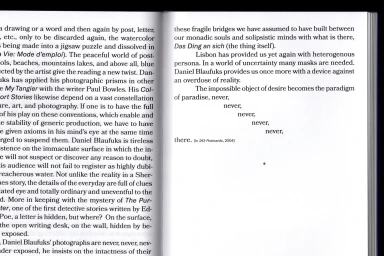 Open book layout with two pages of printed text featuring typography and experimental text alignment