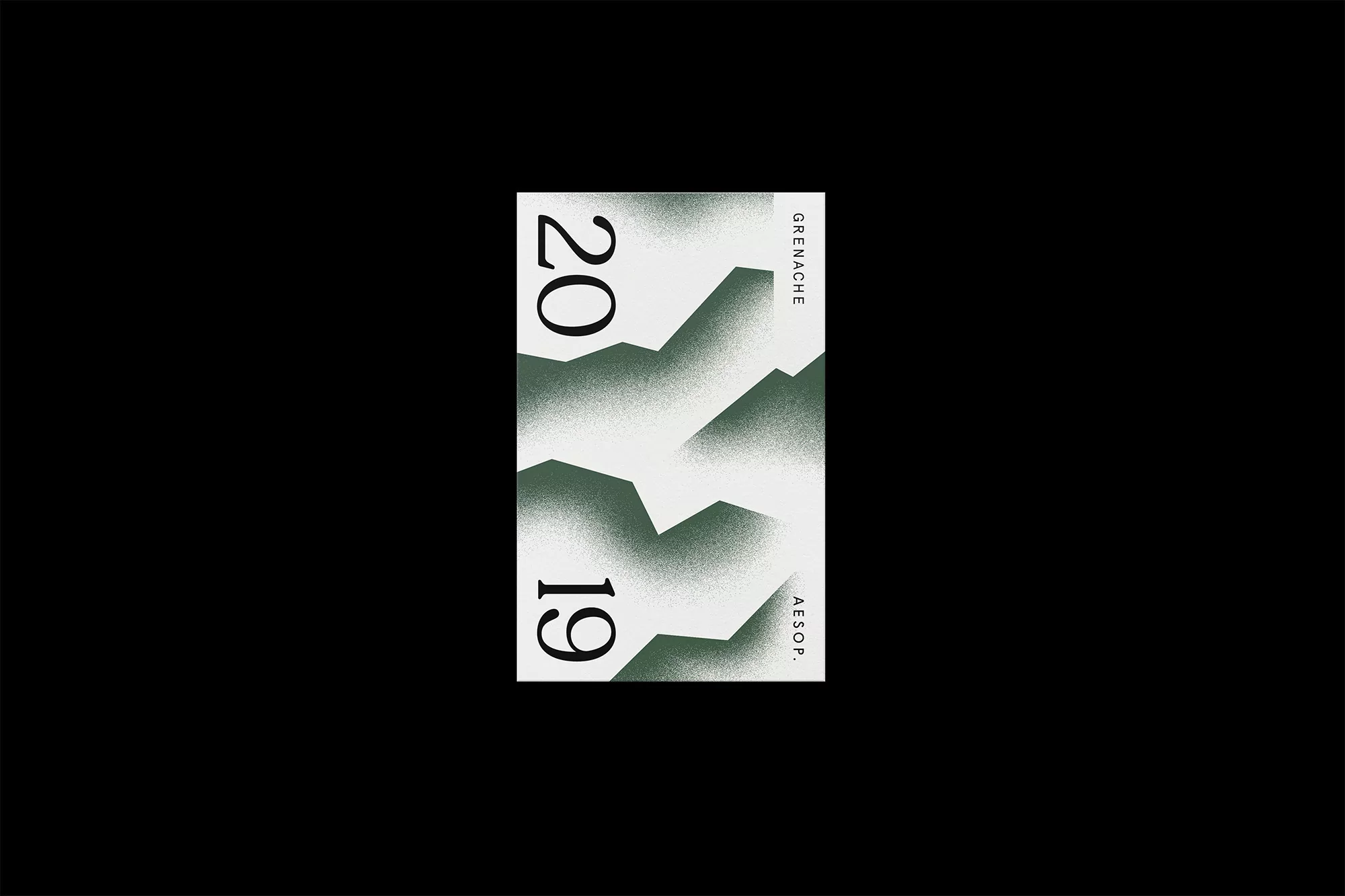 Minimalist product label design featuring geometric mountain shapes, the year '2019', and the brand name 'Aesop.' set against a black background.