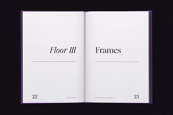 Open book with 'Floor III' on the left page and 'Frames' on the right page against a black background, showcasing typography and design.