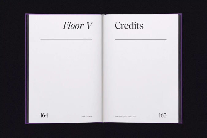 Open book with the title 'Floor V' on the left page and 'Credits' on the right page, set against a black background.