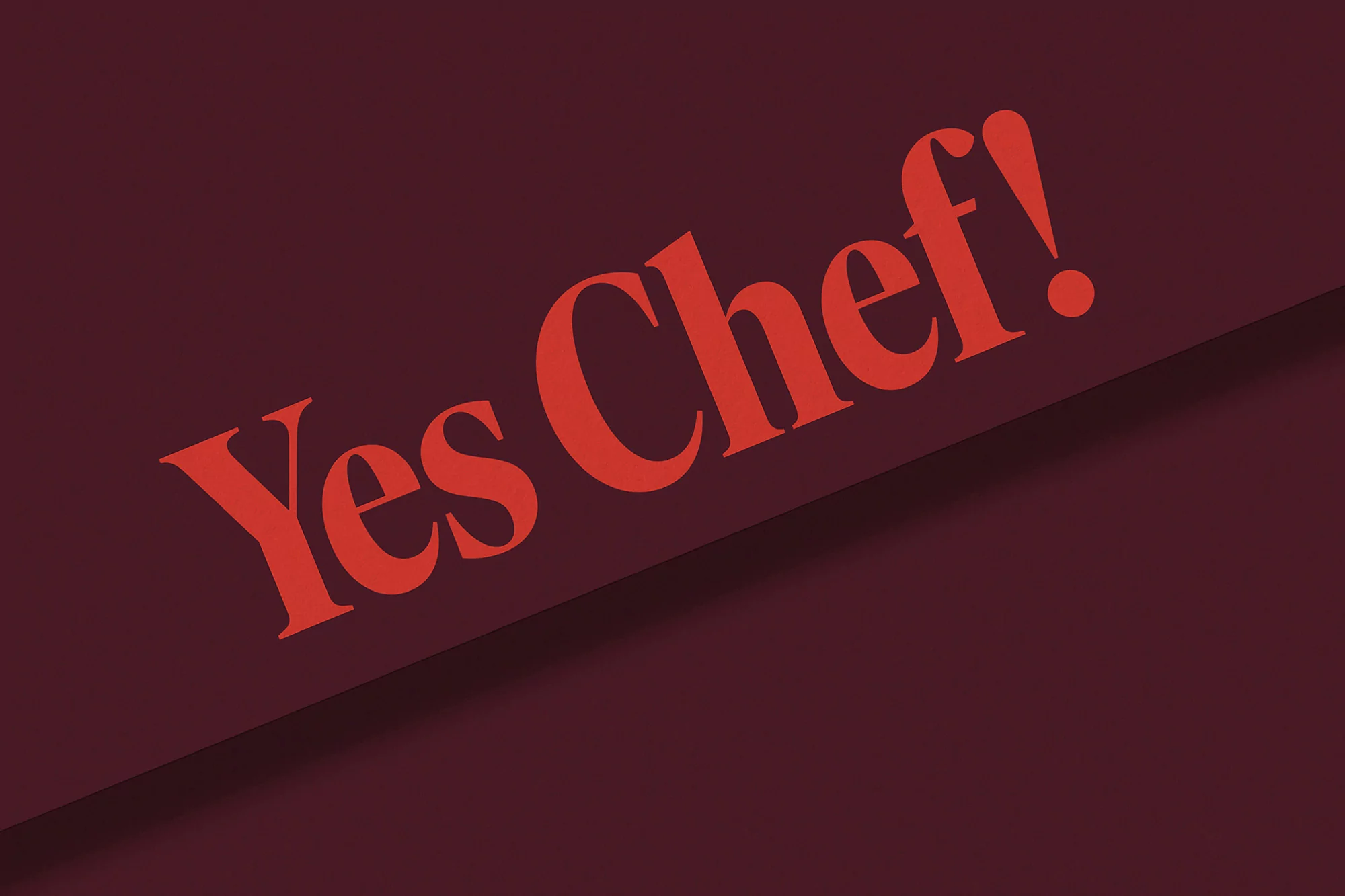 Red graphic text on a burgundy background, reading 'Yes Chef!' in a stylized serif font with a diagonal composition.
