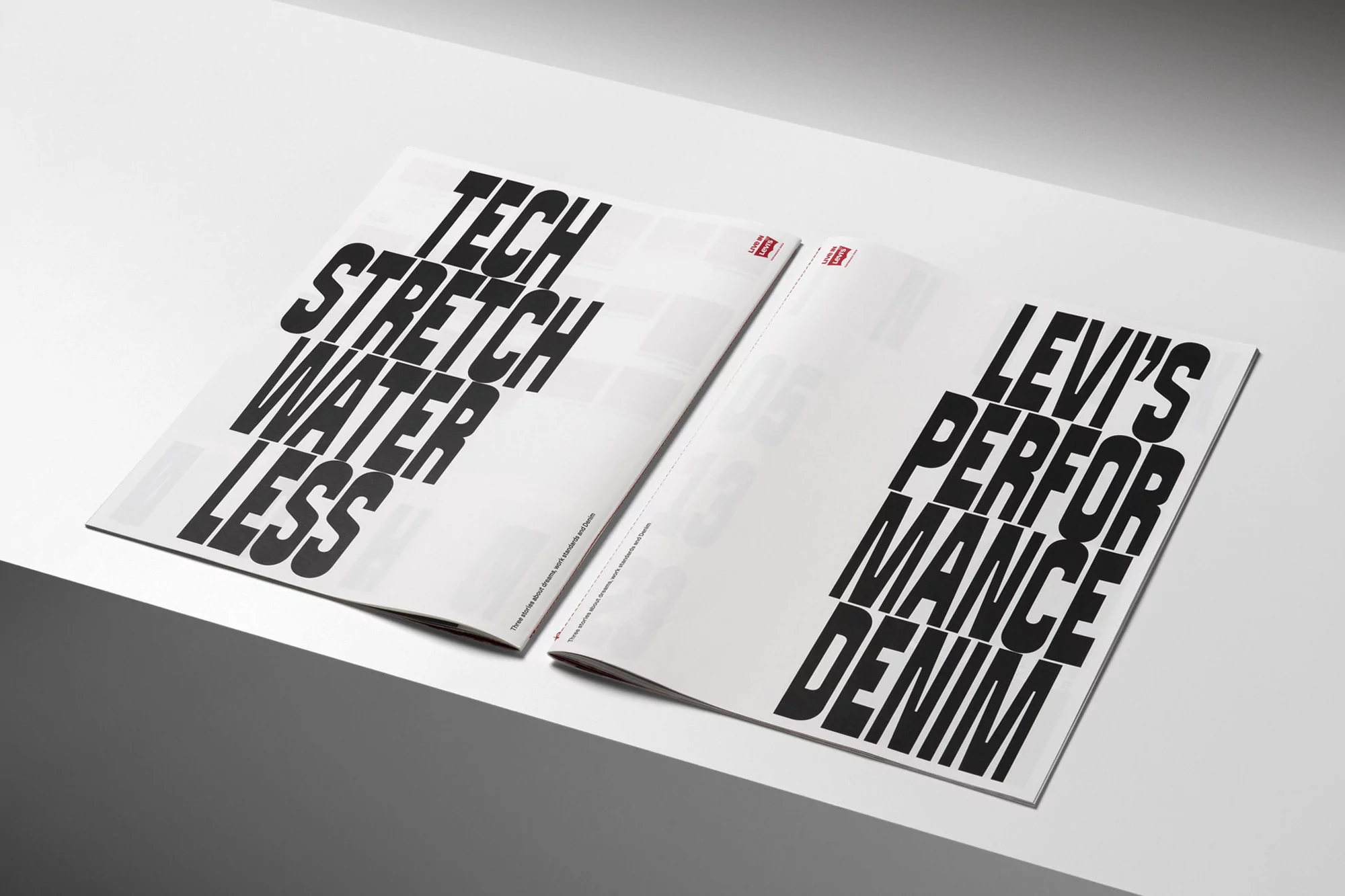 Open magazine spread featuring bold typography promoting 'Tech Stretch Water Less' and 'Levi's Performance Denim' on a white surface.