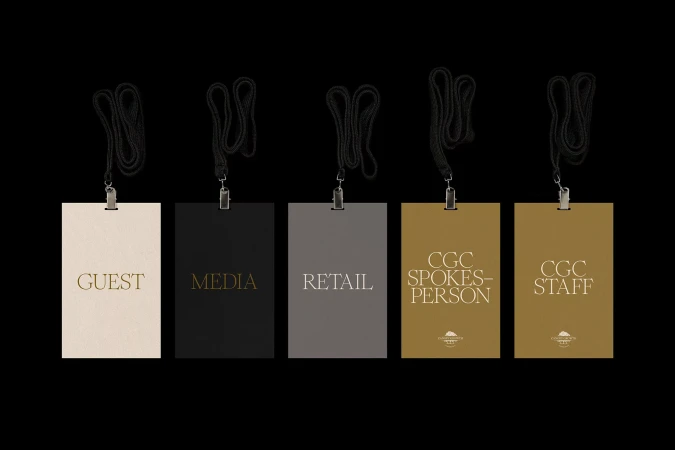 Promotional image featuring five identification badges with lanyards against a black background, labeled Guest, Media, Retail, Spokesperson, and Staff.