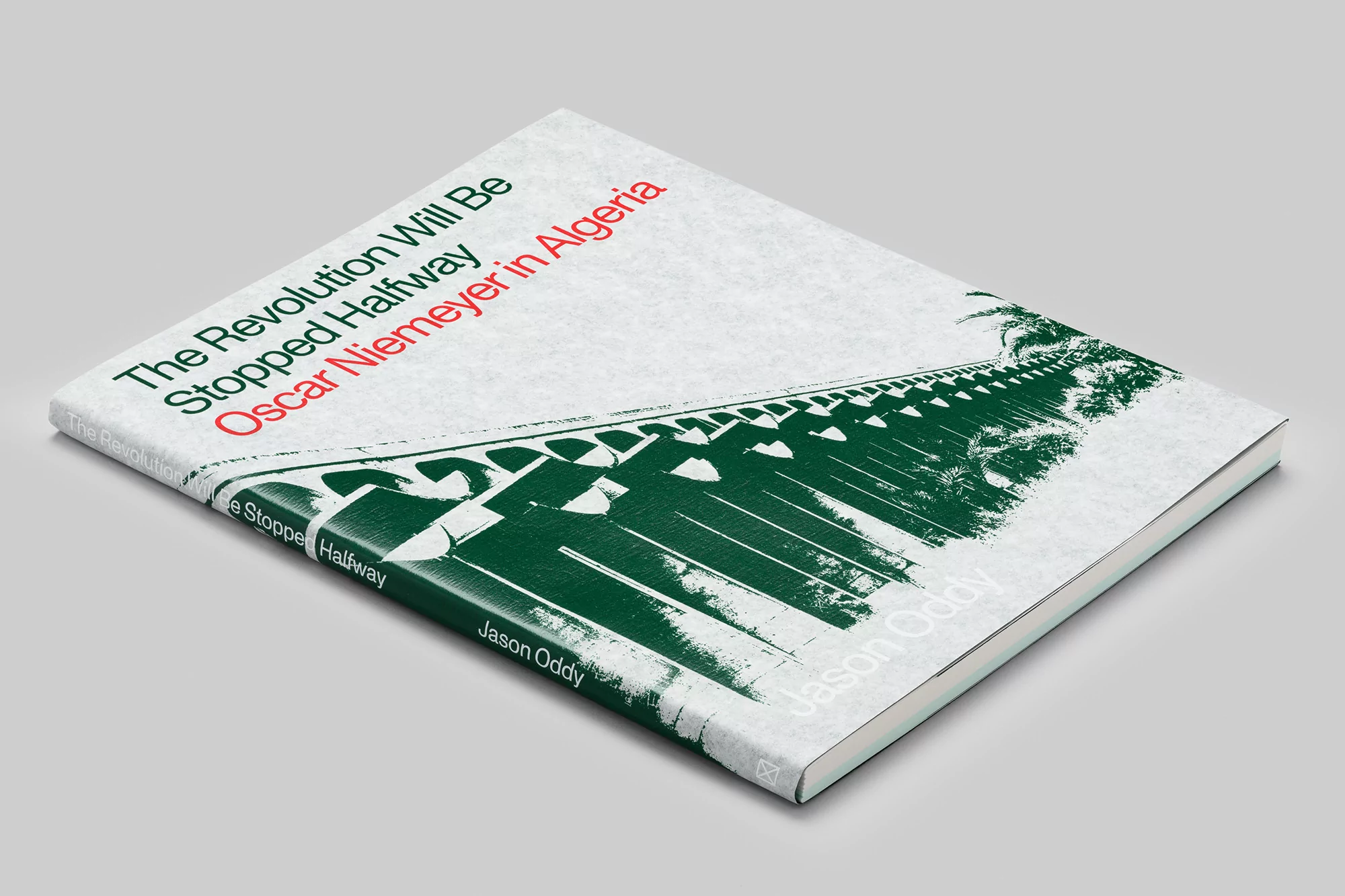Book cover featuring an image of architecture and the title 'The Revolution Will Be Stopped Halfway' by Oscar Niemeyer in Algeria.