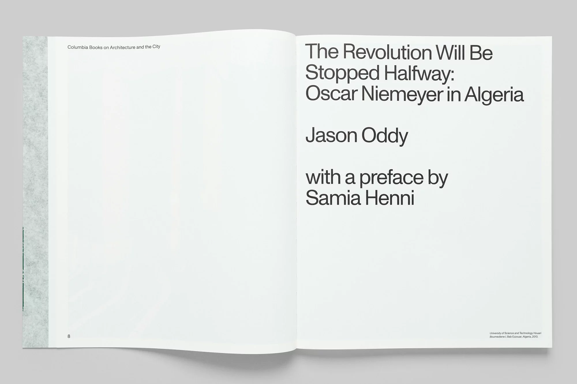 Open book displays title 'The Revolution Will Be Stopped Halfway: Oscar Niemeyer in Algeria' by Jason Oddy with preface by Samia Henni.
