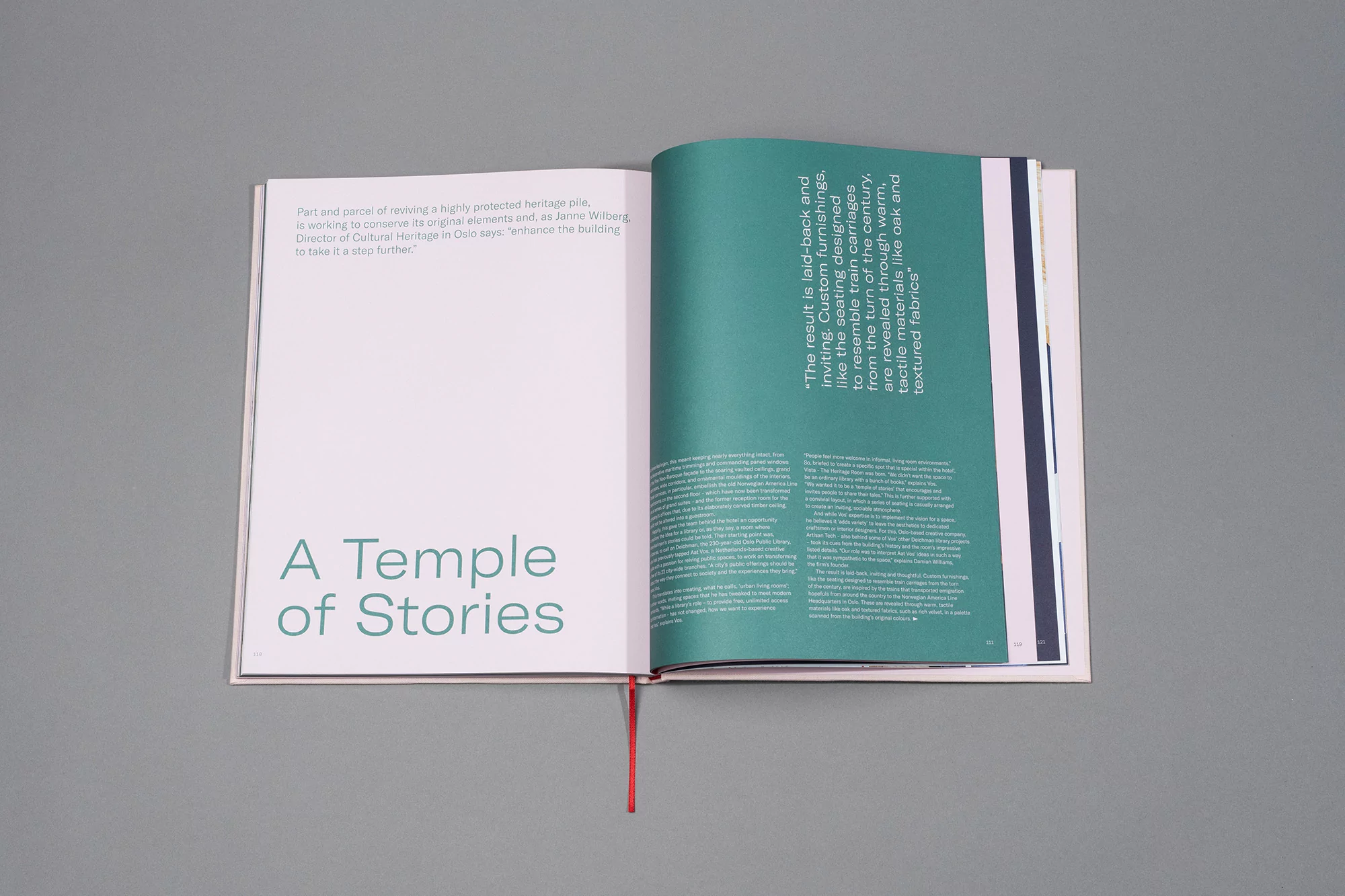 Open book displays interior design writing, with a teal accent page featuring white text, set on a solid gray background.