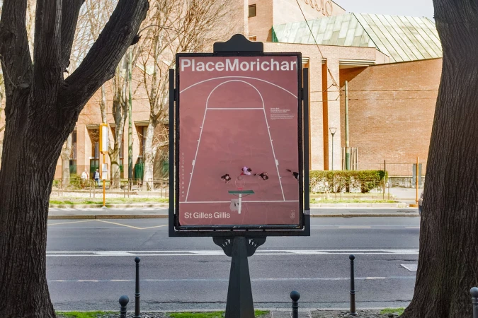 Outdoor shot of Place Morichar basketball court graphic displayed on a signpost, surrounded by trees and an urban street.