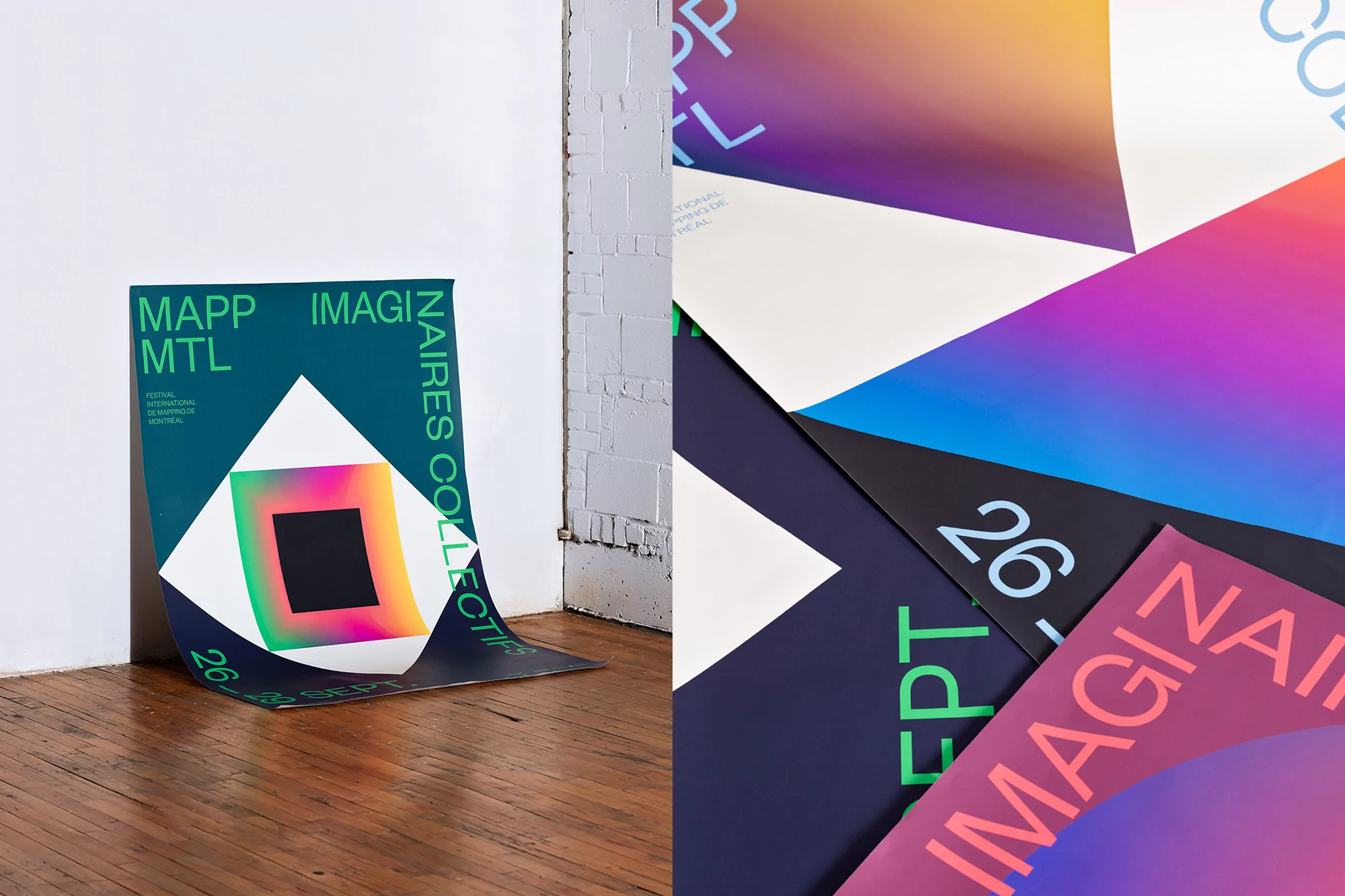 Colorful geometric posters featuring abstract shapes on a wood floor against a white wall, creating a modern art installation.