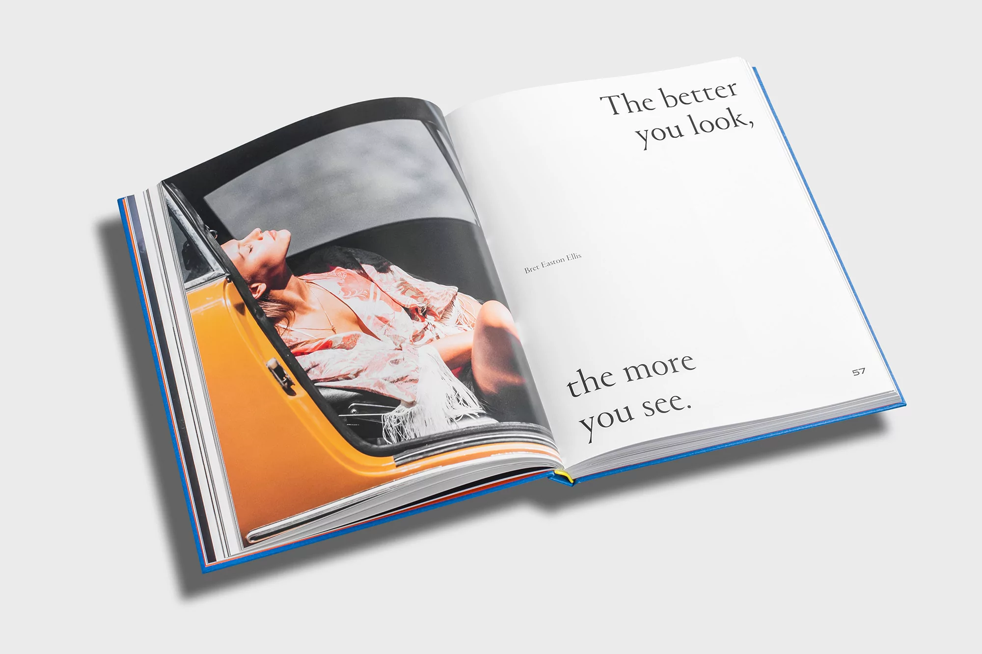 Open book features a woman reclining in a car, beside text that reads, “The better you look, the more you see.”
