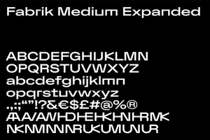 White typography alphabet on a black background displaying Fabrik Medium Expanded font glyphs and punctuation marks.