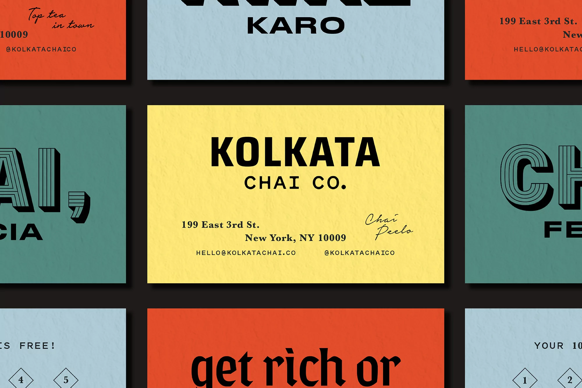 Eye-level shot of vibrant business cards featuring bold typography and geometric designs, set against a dark background, design concept.