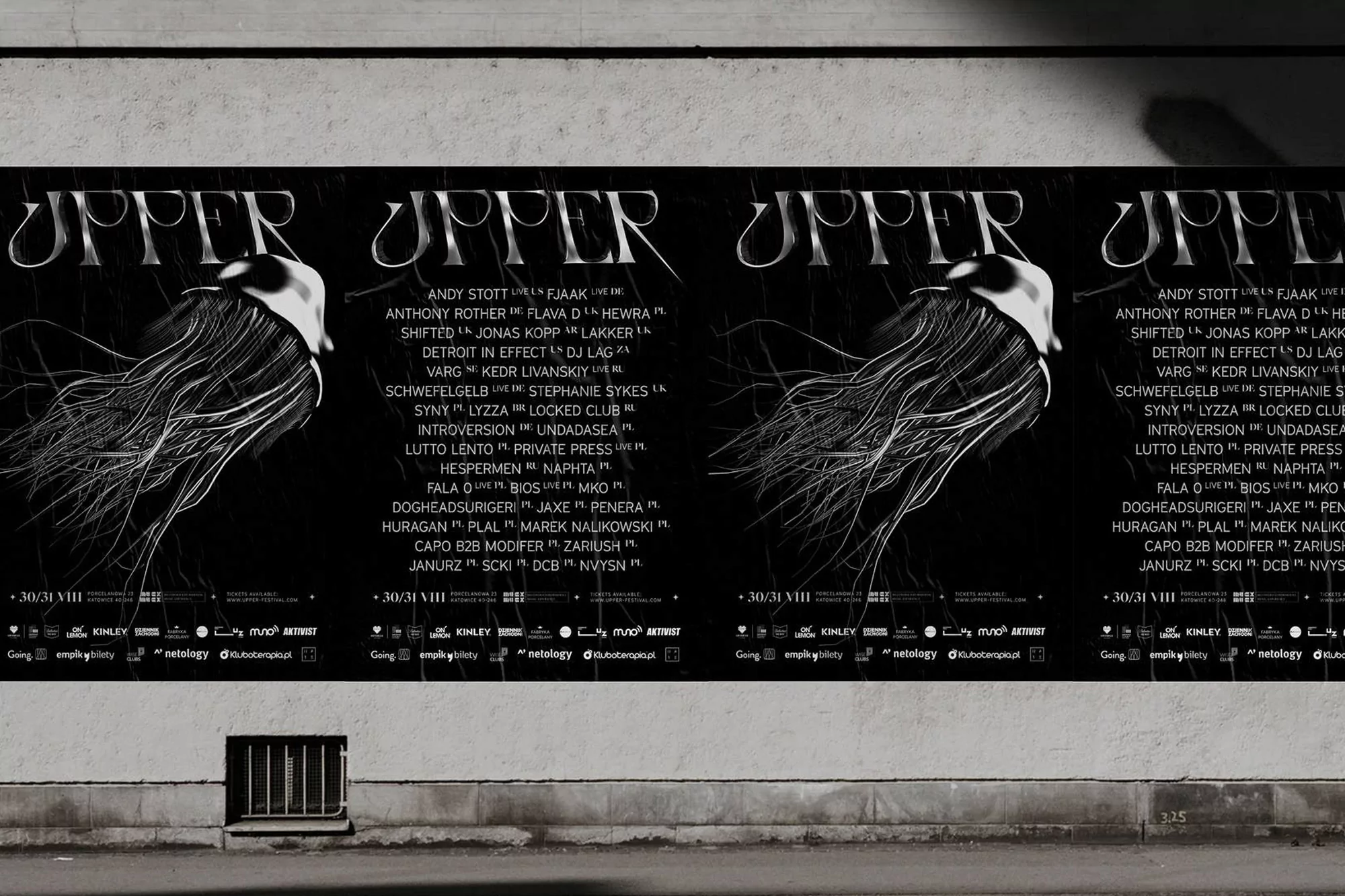 Black and white posters on a textured wall advertise an event. Visible text includes event names and dates, offering event information.