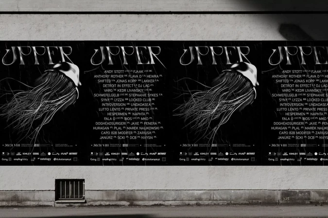 Four black event posters featuring jellyfish illustrations and white typography pasted on a textured concrete wall.