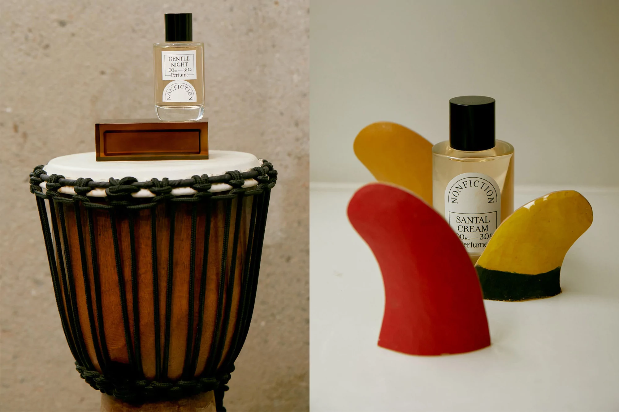 Still life of two perfume bottles: one on a djembe drum, the other with colorful surfboard fins, showcasing contrasting presentation styles.