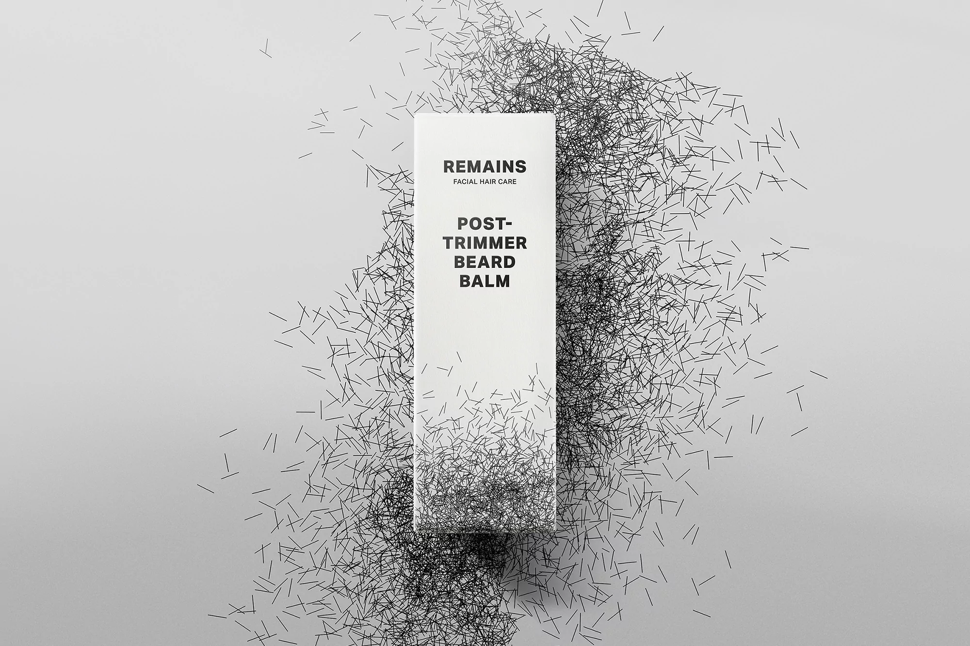 White beard balm bottle by Remains with text 'Remains Facial Hair Care' surrounded by a graphic of black beard trimmings.