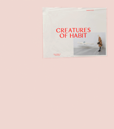 Creatures of Habit book cover featuring a person looking at an art installation inside an art gallery. Saint Levy's logo is on the upper-right.