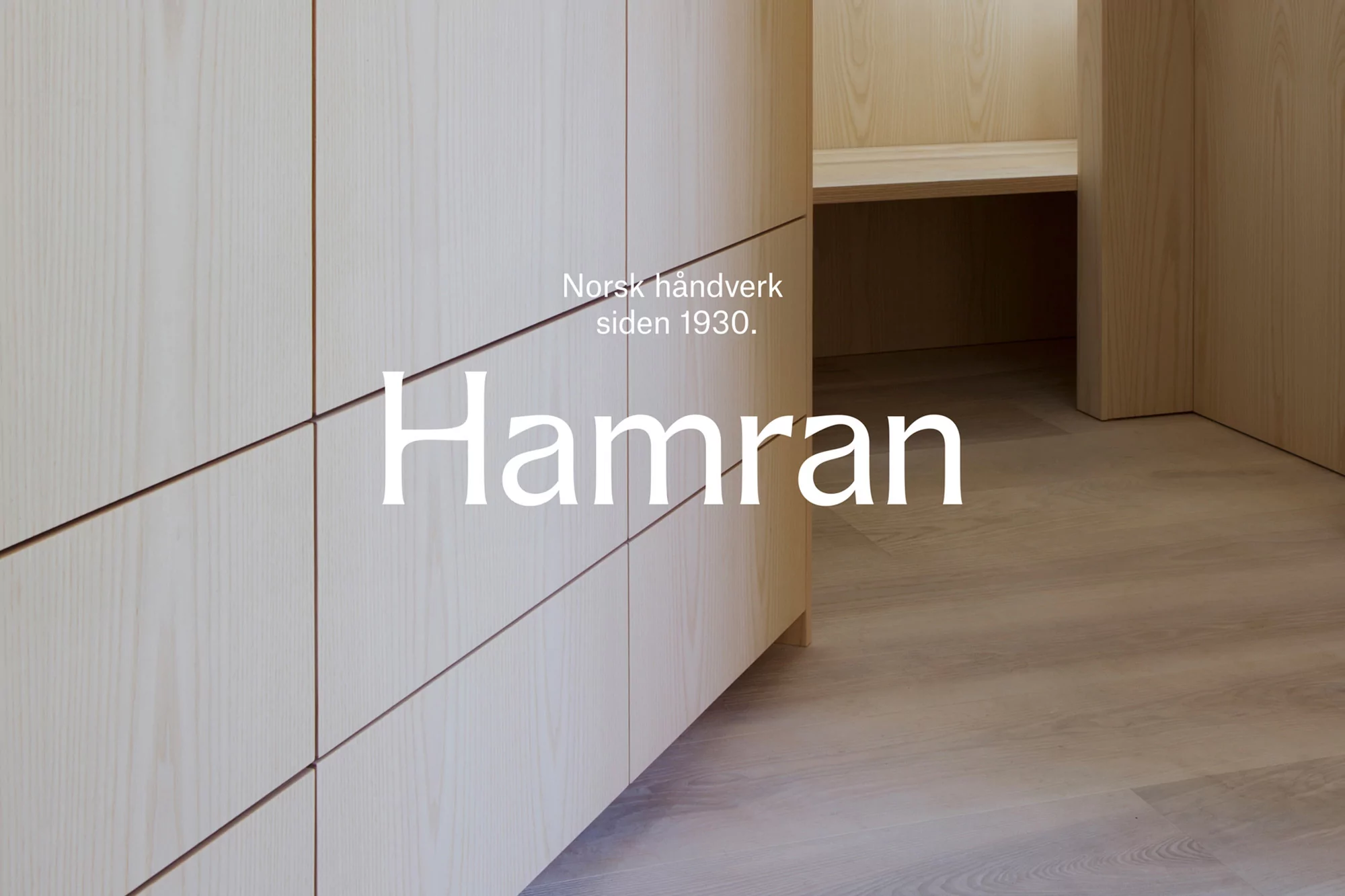 Minimalist interior featuring light wood cabinetry and flooring, showcasing clean lines and natural textures for a serene aesthetic.