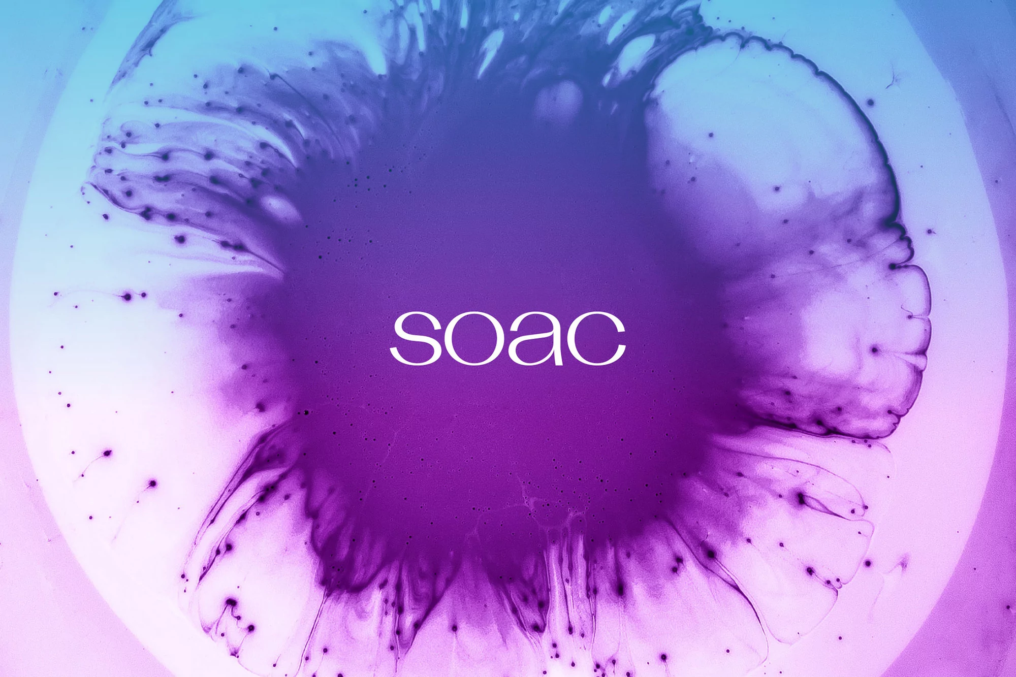 Abstract image with a purple ink blot on a light blue and pink background, creating a visually striking and modern design.