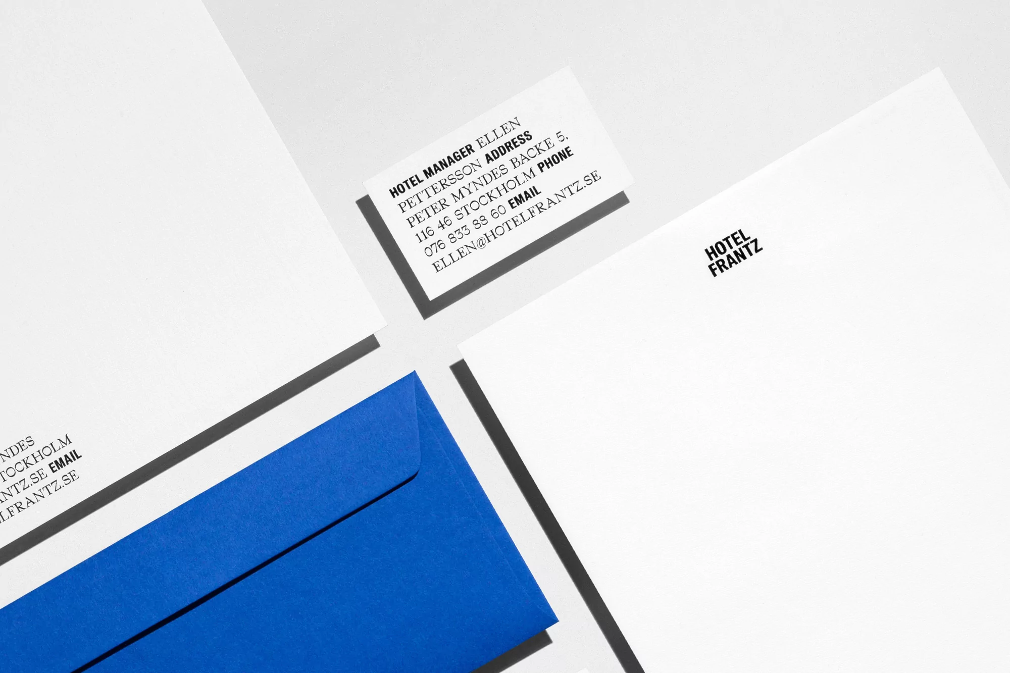 Close-up product shot of Hotel Frantz stationery featuring letterhead, envelope, and business card in a clean, minimalist aesthetic.