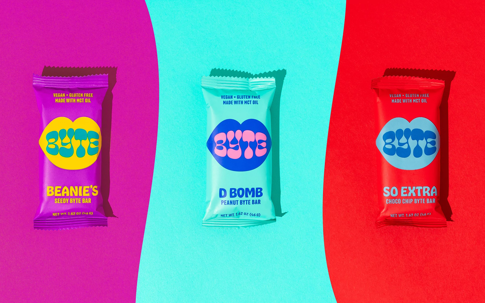 Three colorful snack bars labeled Byte arranged on a vibrant background of magenta, cyan, and red curved panels.