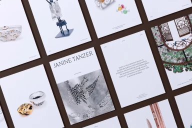 Flat lay grid arrangement of printed pages and editorial layouts featuring artwork, sculptures, and typography against a dark background.