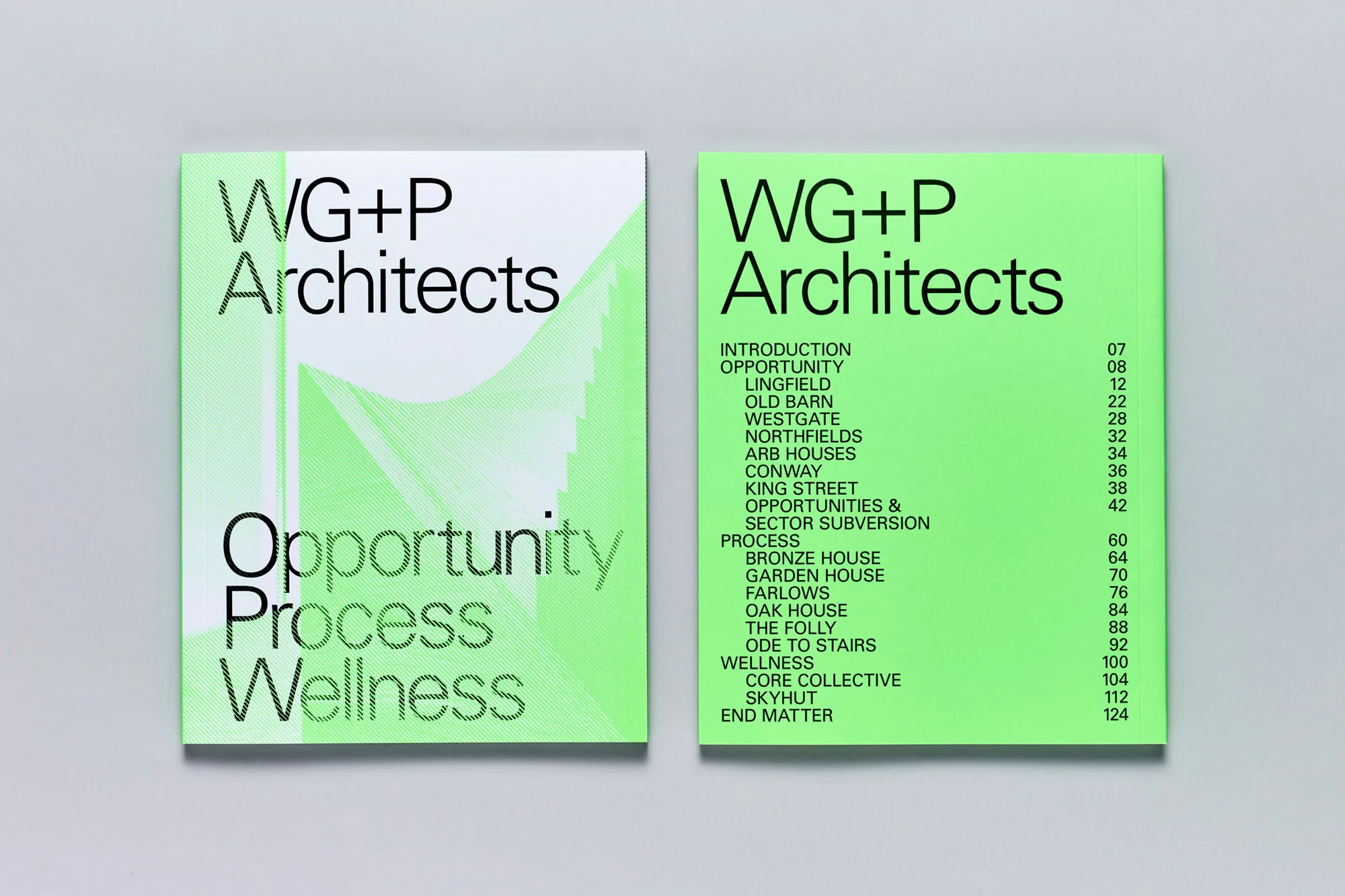 Two copies of the same architectural design book, titled WG+P Architects, sit side-by-side on a neutral surface, showcasing clean modern design.