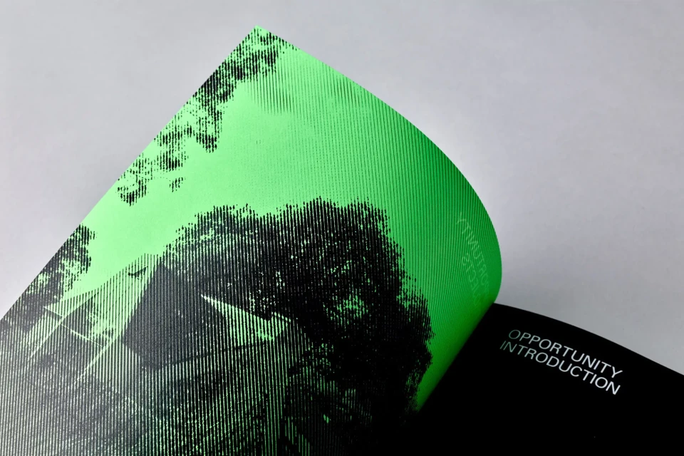 Two pages of a design document, one with a black and green graphic of a building, and another page with the words 'Opportunity Introduction'.