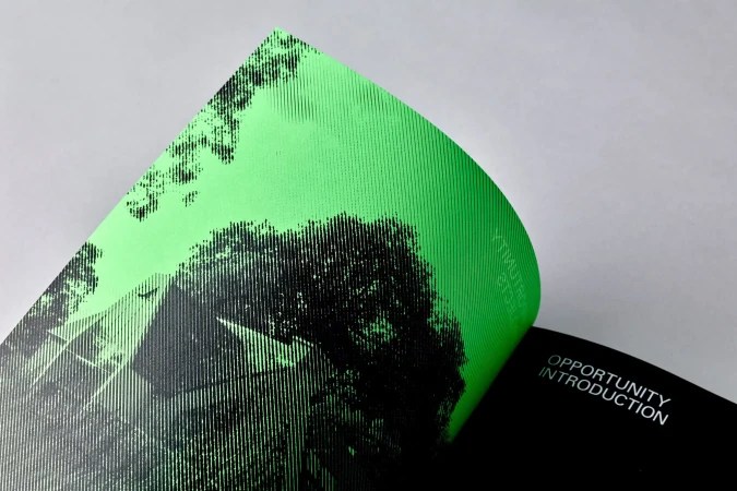 Two pages of a design document, one with a black and green graphic of a building, and another page with the words 'Opportunity Introduction'.
