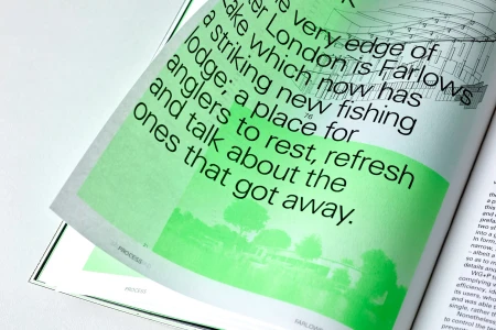 Close-up of an open printed book page with bold black typography overlaid on a vibrant green highlight box and architectural line drawing.