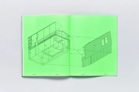 An open book displaying bright green pages with detailed architectural floor plan illustrations and line drawings.