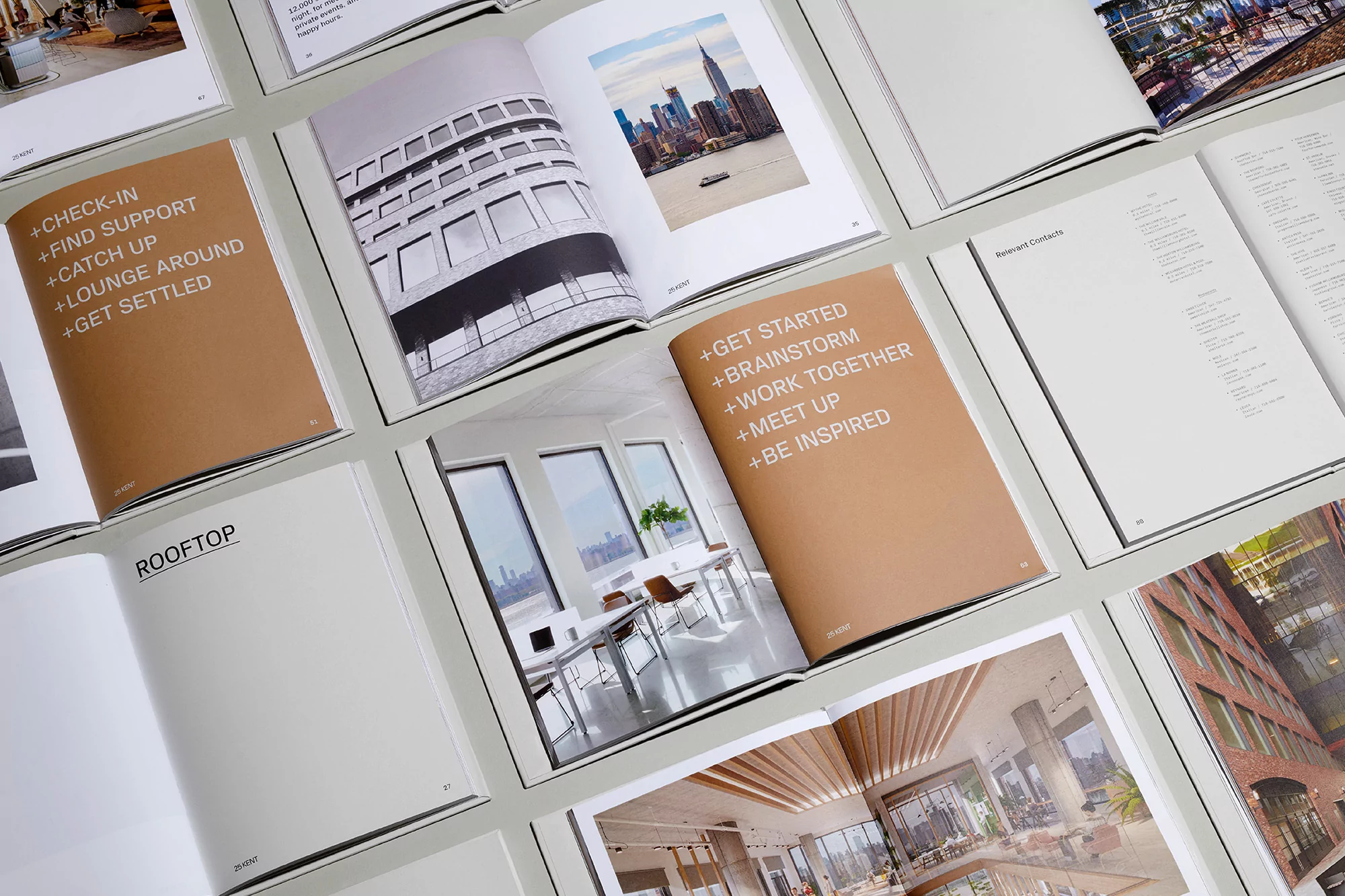 Open book display featuring architectural and interior design photography, complemented by text layouts, set against a neutral background.
