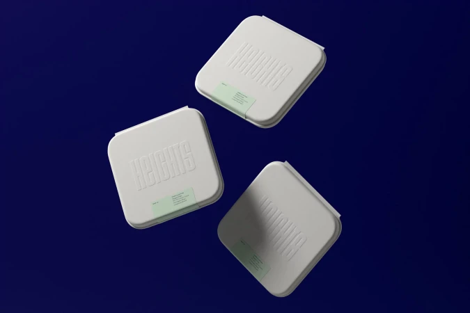 Three white Heights supplement boxes are arranged against a dark blue backdrop, each featuring the brand name and a product label.