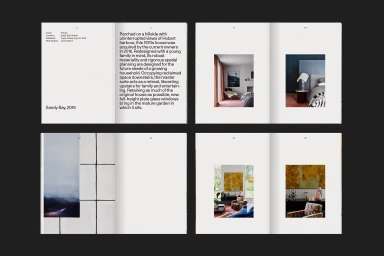 Spread pages of a minimalist design portfolio featuring architectural photography and project descriptions against white paper