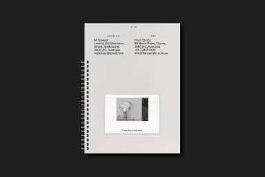 Top-bound spiral notebook featuring minimal typography and a small centered photographic print on the cover for Flack Studio brand identity.