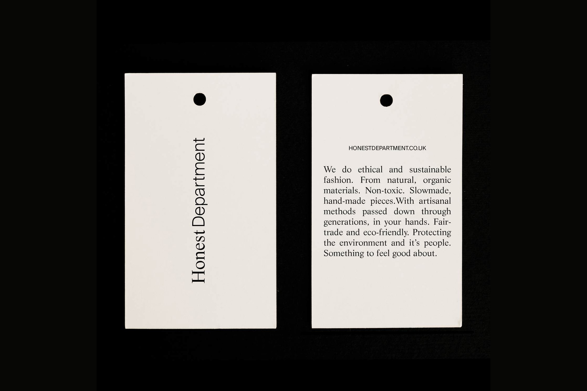 Two product hang tags on a black background. One reads 'Honest Department' while the other details the brand's ethical fashion.