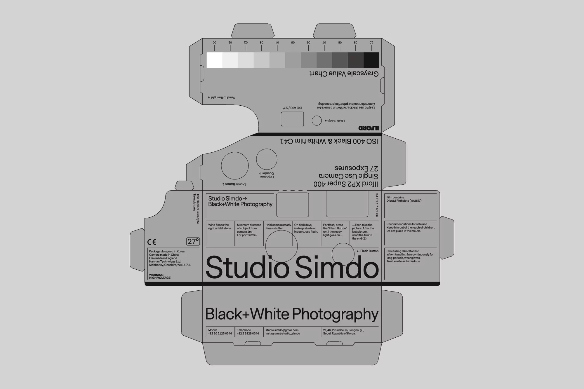 Studio Simdo black and white photography single use camera box featuring grayscale value chart and camera exposure information.