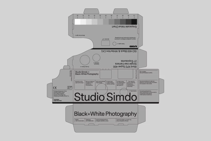 Studio Simdo black and white photography single use camera box featuring grayscale value chart and camera exposure information.