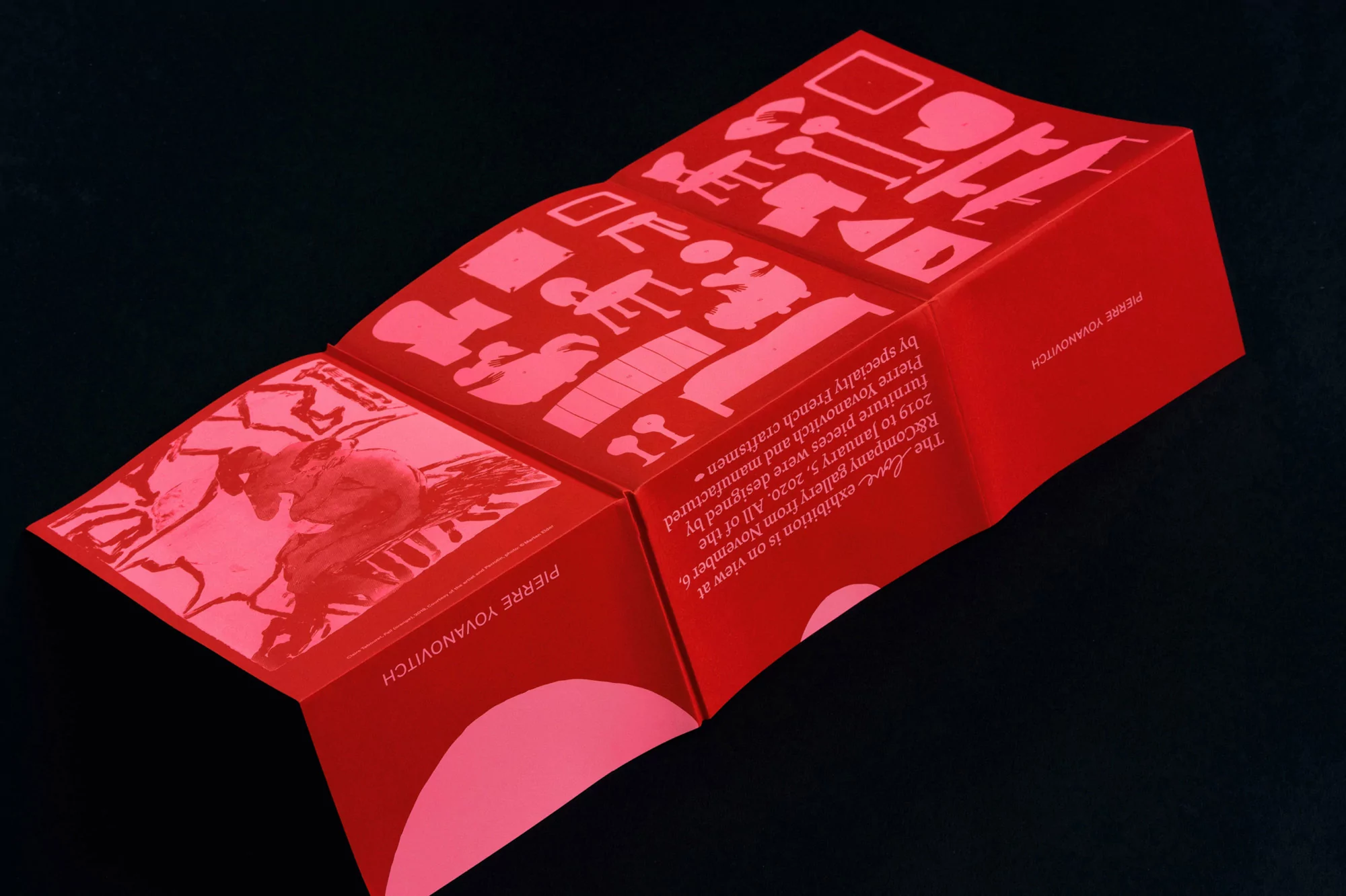 Promotional brochure for Pierre Yovanovitch R&Company gallery exhibition featuring furniture designs in red and white on black background.