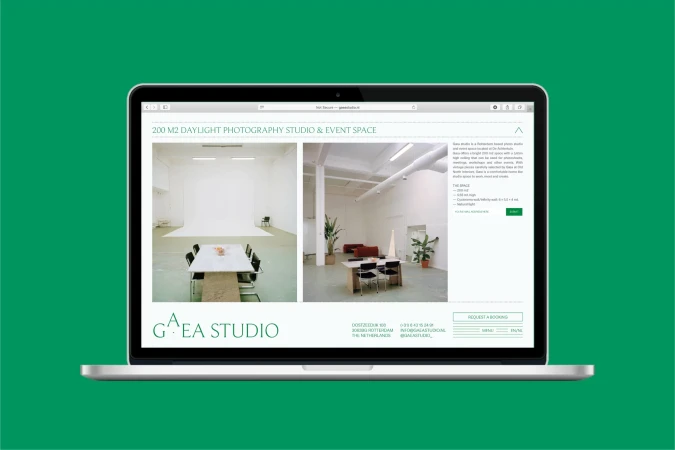 Laptop displaying a photography studio and event space website with images of the studio's interior and contact details on a green background.