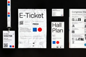 Flat lay of DMEXCO brand identity items including a visitor pass, e-ticket, business card, hall plan, and conference guide on black surface