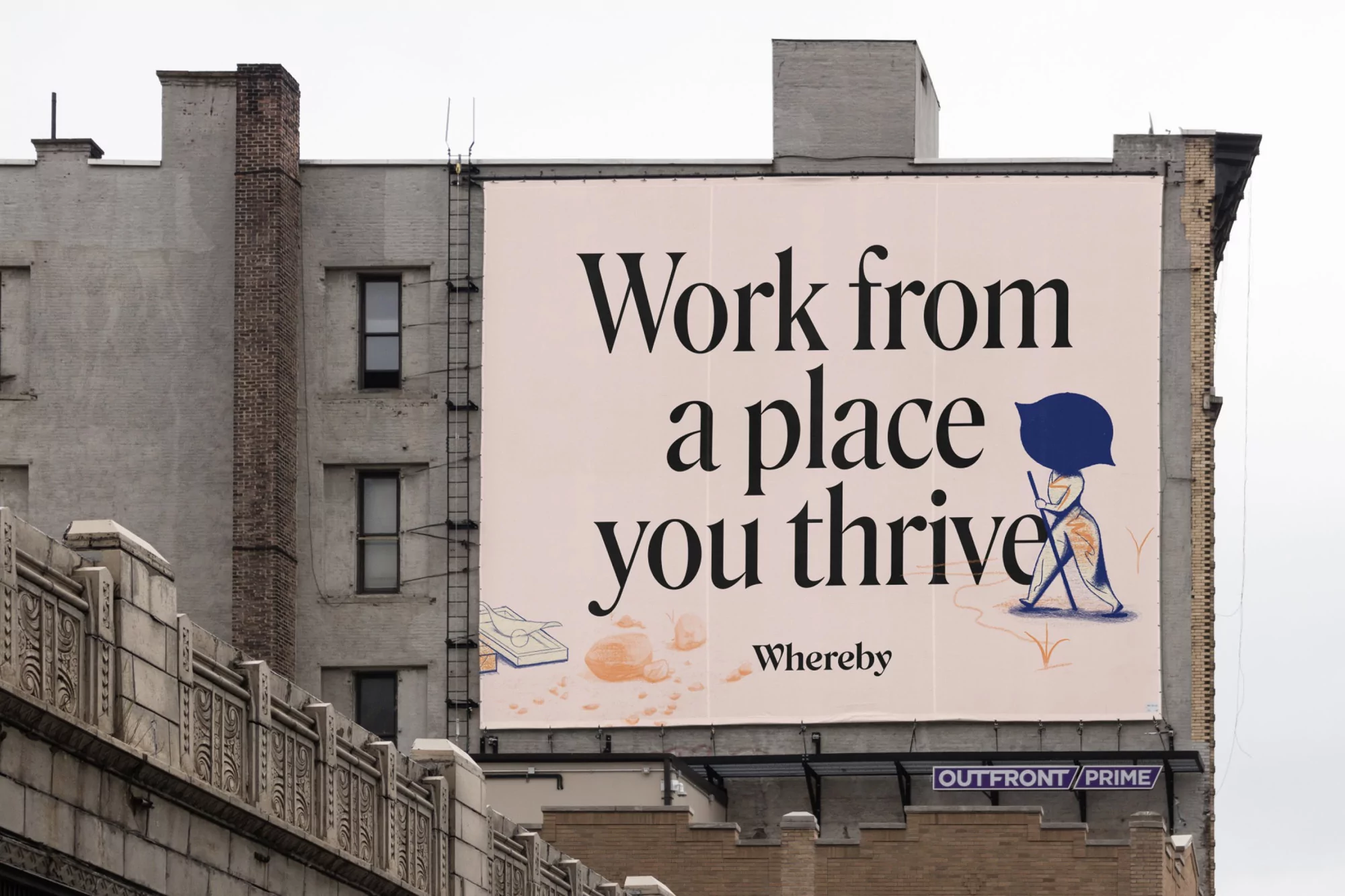 Billboard advertisement on a building, promoting remote work with illustration of a person and text saying 'Work from a place you thrive'.