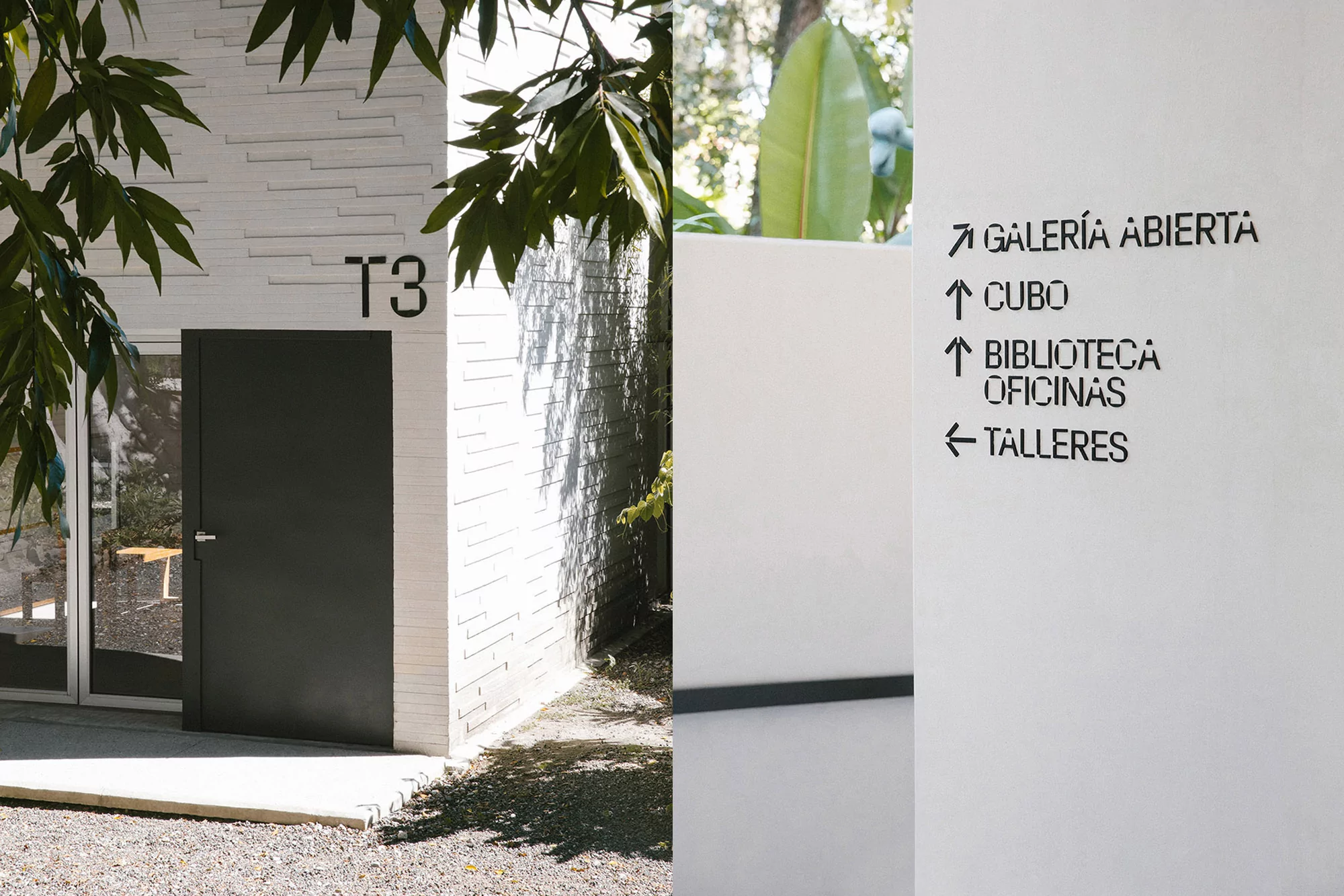 Exterior view of a modern building with a black door, white brick wall, and minimalist signage, showcasing contemporary architecture.