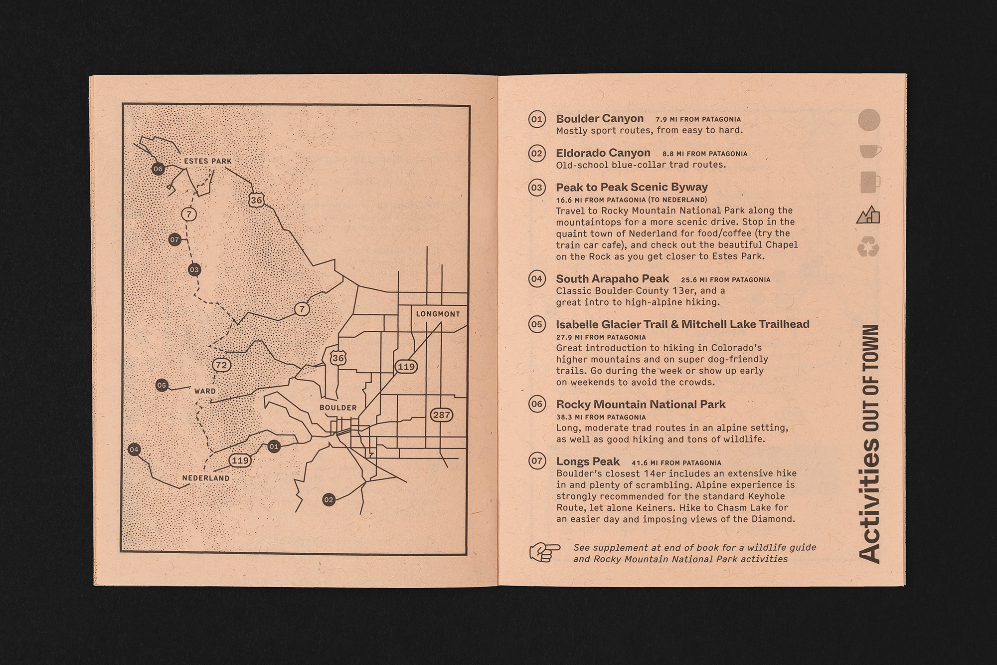 Guidebook spread open featuring maps and descriptions of outdoor activities near Boulder, Colorado, including hiking trails and scenic routes.