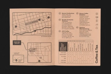 An open printed brochure showing a black map on pink paper with street names and numbered location markers alongside descriptive coffee shop text.