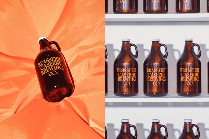Brasserie Caserne Brewing Co. bottles on display against an orange fabric and white shelving for product marketing and advertising.