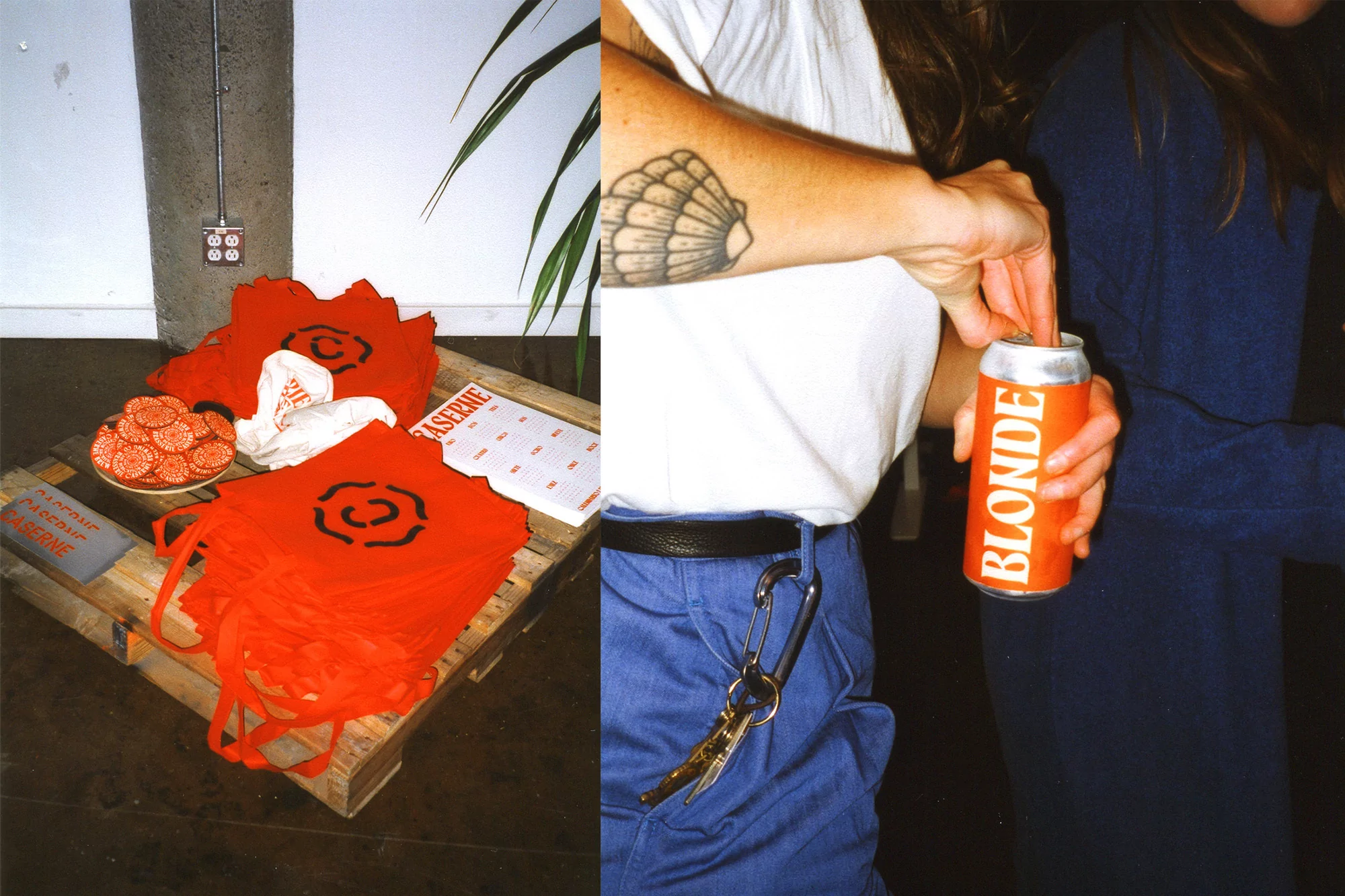 Indoor shot featuring two people, one opening a Blonde beer can, beside a display of branded red tote bags on a wooden pallet.