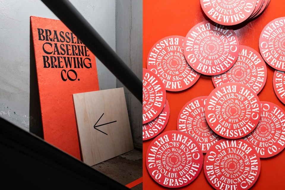 Signage for Brasserie Caserne Brewing Co. with orange branding and direction arrow, alongside a collection of branded promotional coasters.