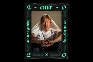 Poster for EMIR brand identity featuring a man in a white t-shirt with a white cloth draped over his head against a dark background.